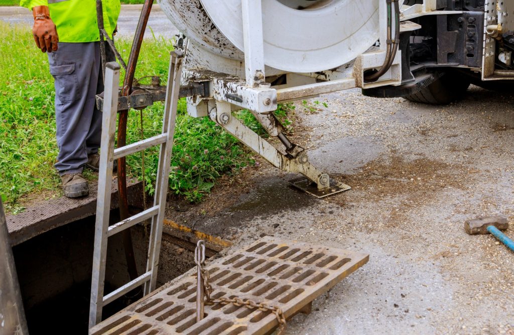 workers performing a catch basin cleaning service