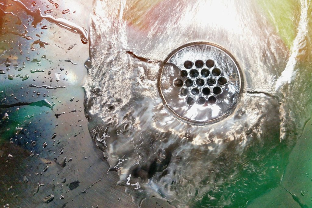 water swirling down the drain